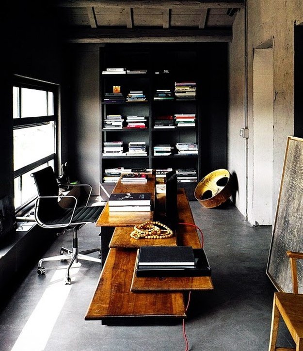 Black walls contrasted with good lighting in your men's office with exposed cement ceilings and floors make for sophisticated and elegant design for the bold man. | 10 Man Cave Ideas For Real Men